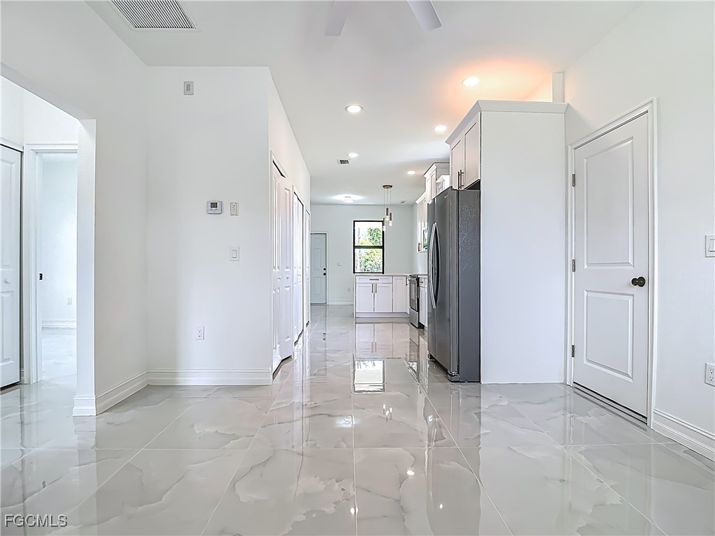 3705 8th Street Southwest Lehigh Acres, FL 33976 - Photo 6 of 34 a view of a hallway