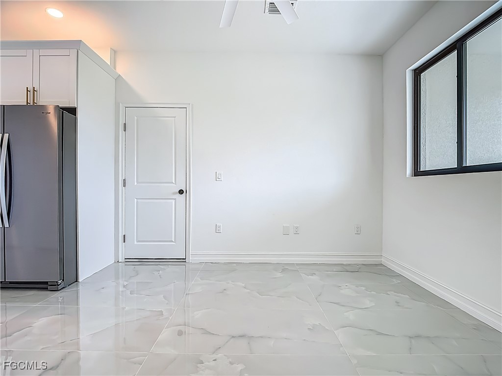 3705 8th Street Southwest Lehigh Acres, FL 33976 - Photo 8 of 34 an empty room with a window