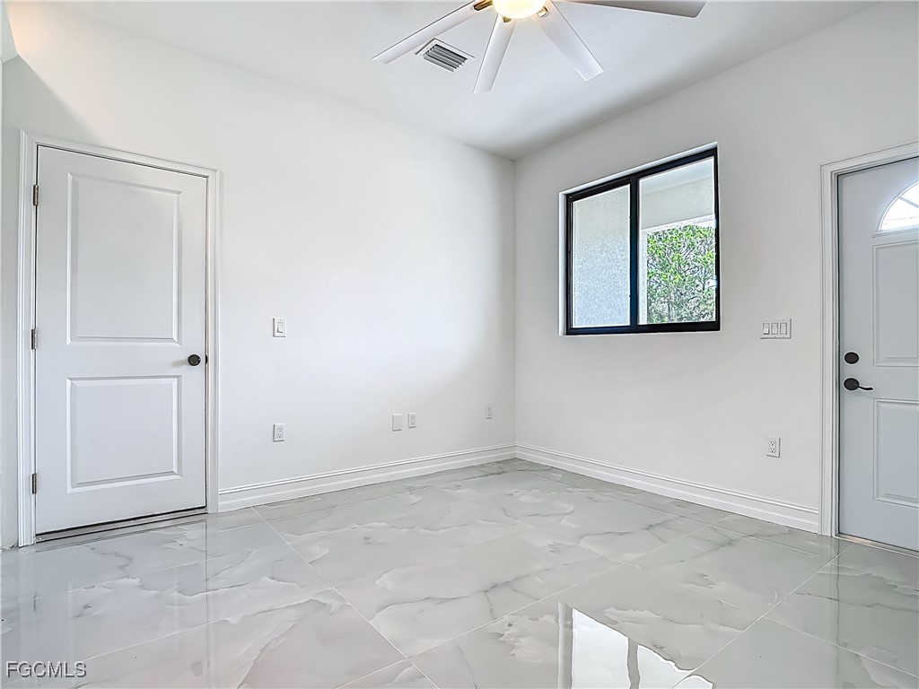 3705 8th Street Southwest Lehigh Acres, FL 33976 - Photo 9 of 34 a view of an empty room with a window