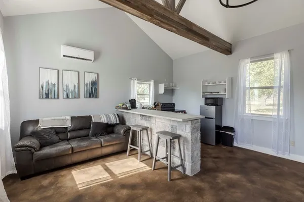 a living room with furniture and a window