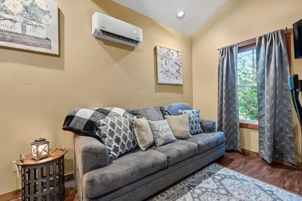 a living room with furniture and a window