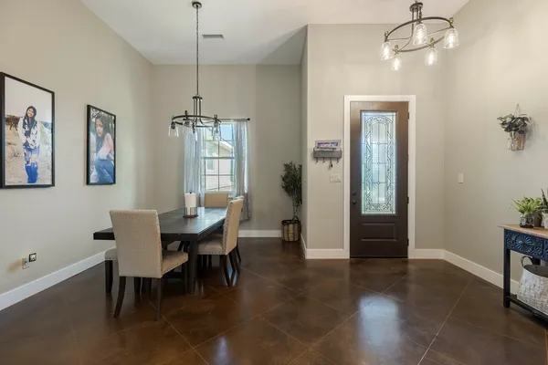 a dining room with furniture and window
