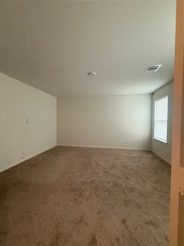 a view of an empty room and window