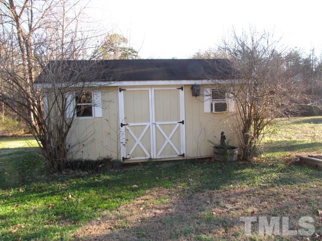 1857 Red Marshall Road Pelham, NC 27311 - Photo 3 of 18 a view of a house with backyard and garden