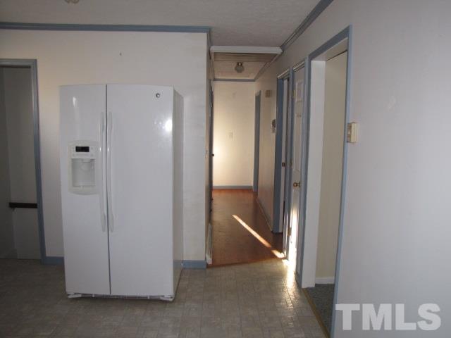 1857 Red Marshall Road Pelham, NC 27311 - Photo 6 of 18 a view of a hallway with wooden floor