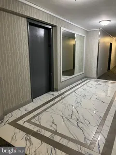 a bedroom with a bed and a mirror