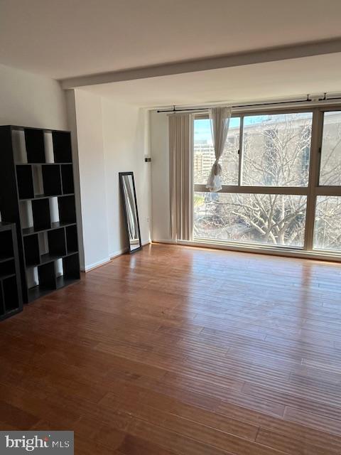 922 24th Street Northwest, Unit 718 Washington, DC 20037 - Photo 5 of 28 a view of an empty room with wooden floor and a window