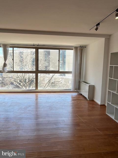 922 24th Street Northwest, Unit 718 Washington, DC 20037 - Photo 7 of 28 a view of an empty room with wooden floor and a window