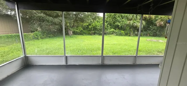a view of an empty room and window