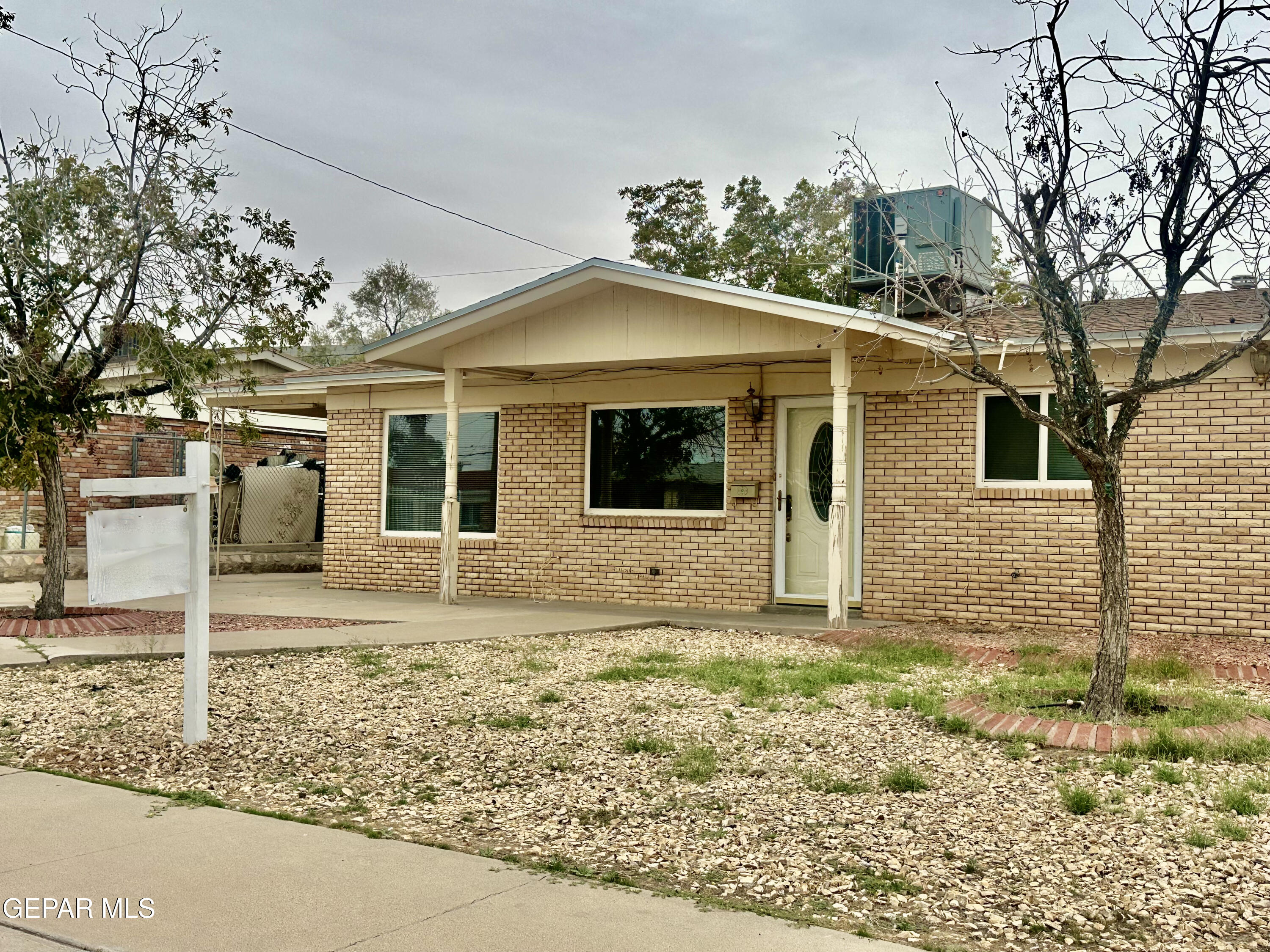8341 Loma Terrace Road El Paso, TX 79907 - Photo 1 of 6 a view of a house with a yard