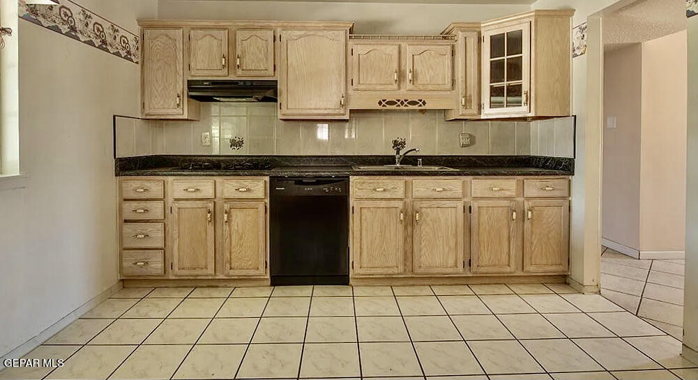 8341 Loma Terrace Road El Paso, TX 79907 - Photo 3 of 6 a kitchen with stainless steel appliances granite countertop a stove a sink and a microwave