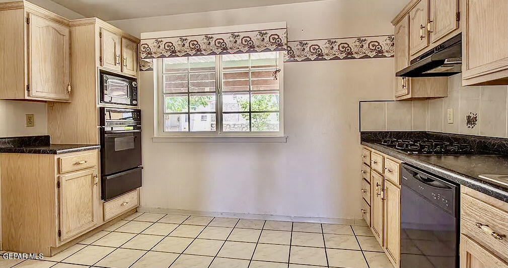 8341 Loma Terrace Road El Paso, TX 79907 - Photo 4 of 6 a kitchen with stainless steel appliances granite countertop a refrigerator and a stove
