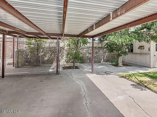 8341 Loma Terrace Road El Paso, TX 79907 - Photo 6 of 6 a backyard of a house with wooden floor and outdoor seating