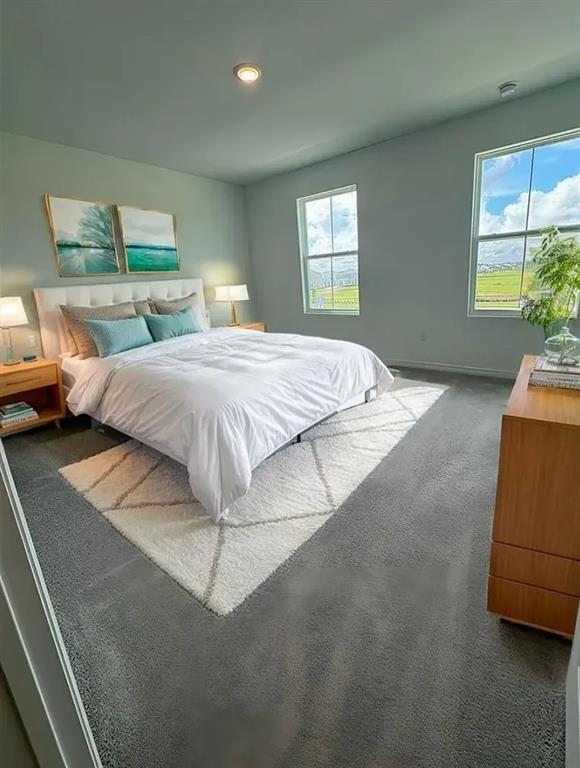 15074 Windflower Alley Winter Garden, FL 34787 - Photo 16 of 18 a bedroom with a bed and window