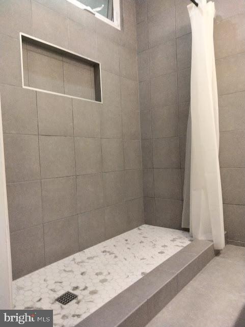 2228 40th Street Northwest, Unit 1 Washington, DC 20007 - Photo 18 of 29 Sleek modern shower with elegant tiles.