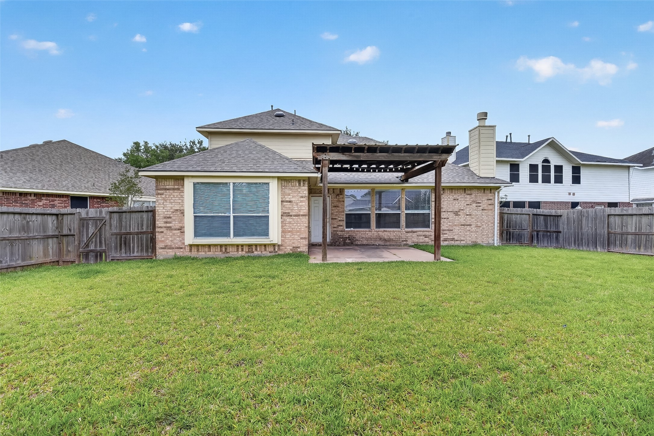 14308 Rocky Briar Lane Rosharon, TX 77583 - Photo 44 of 46 a front view of a house with a garden