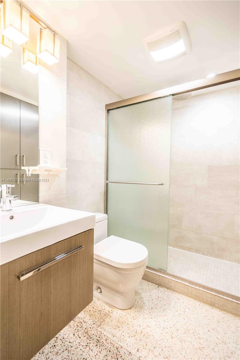 666 Northeast 80th Street, Unit 5 Miami, FL 33138 - Photo 17 of 19 a bathroom with a sink toilet and shower