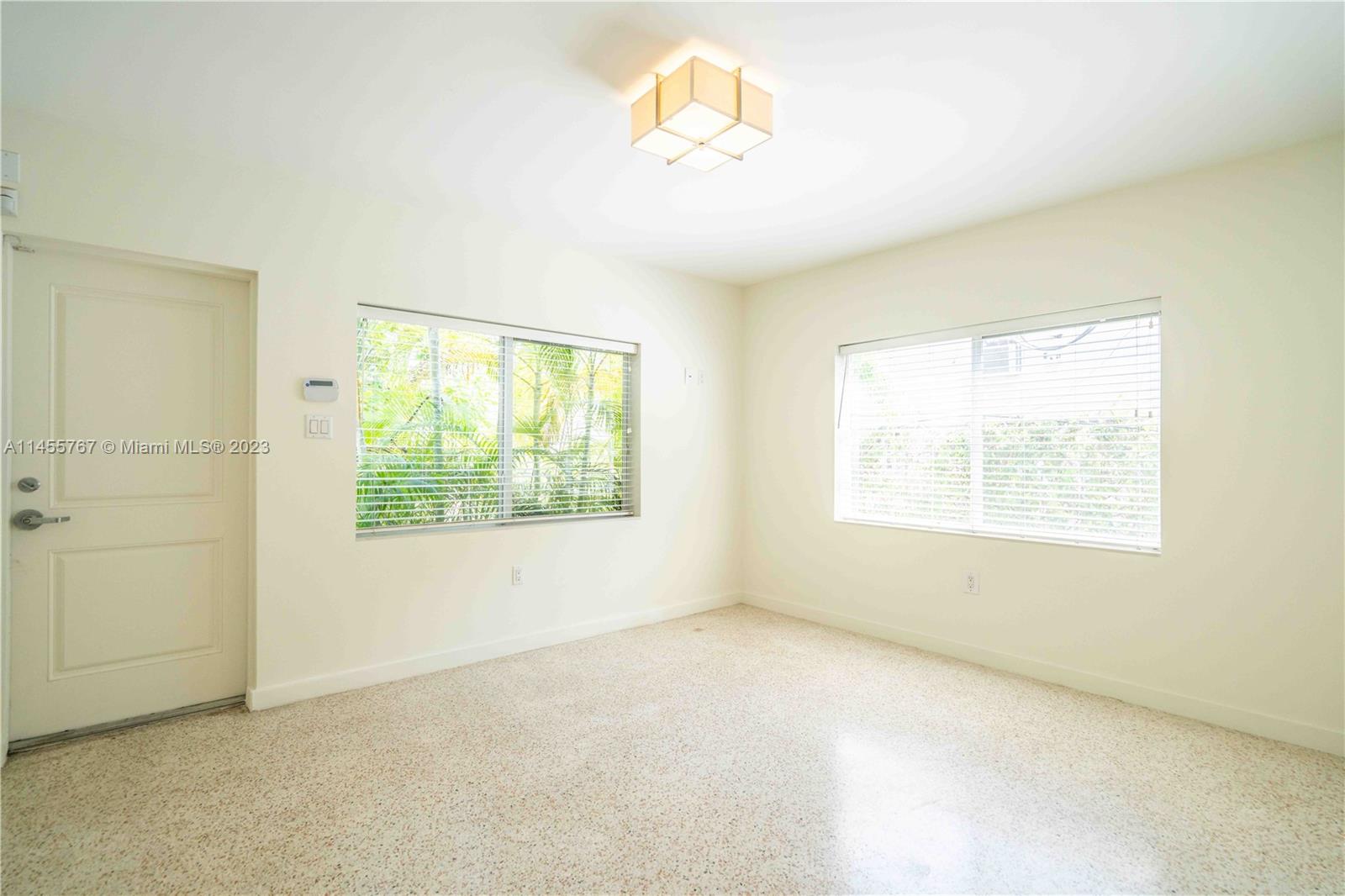666 Northeast 80th Street, Unit 5 Miami, FL 33138 - Photo 3 of 19 a view of an empty room with a window