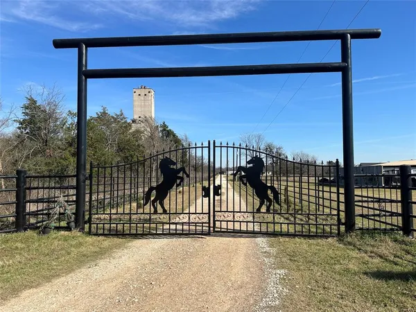 a view of a balcony with a floor to ceiling window and wooden fence