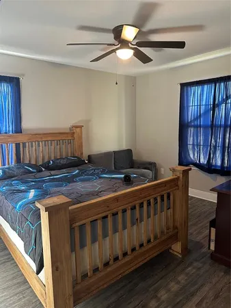 a bedroom with furniture and a window