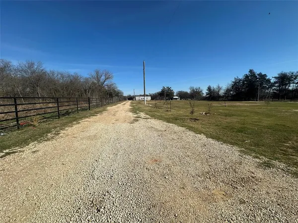 a view of a yard with a lake view