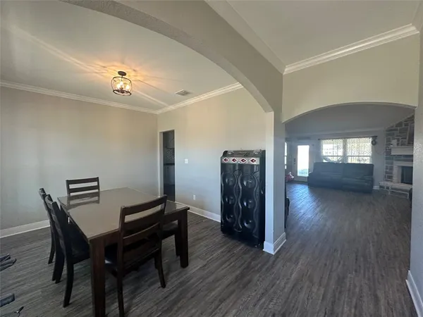 a view of a livingroom with furniture and wooden floor