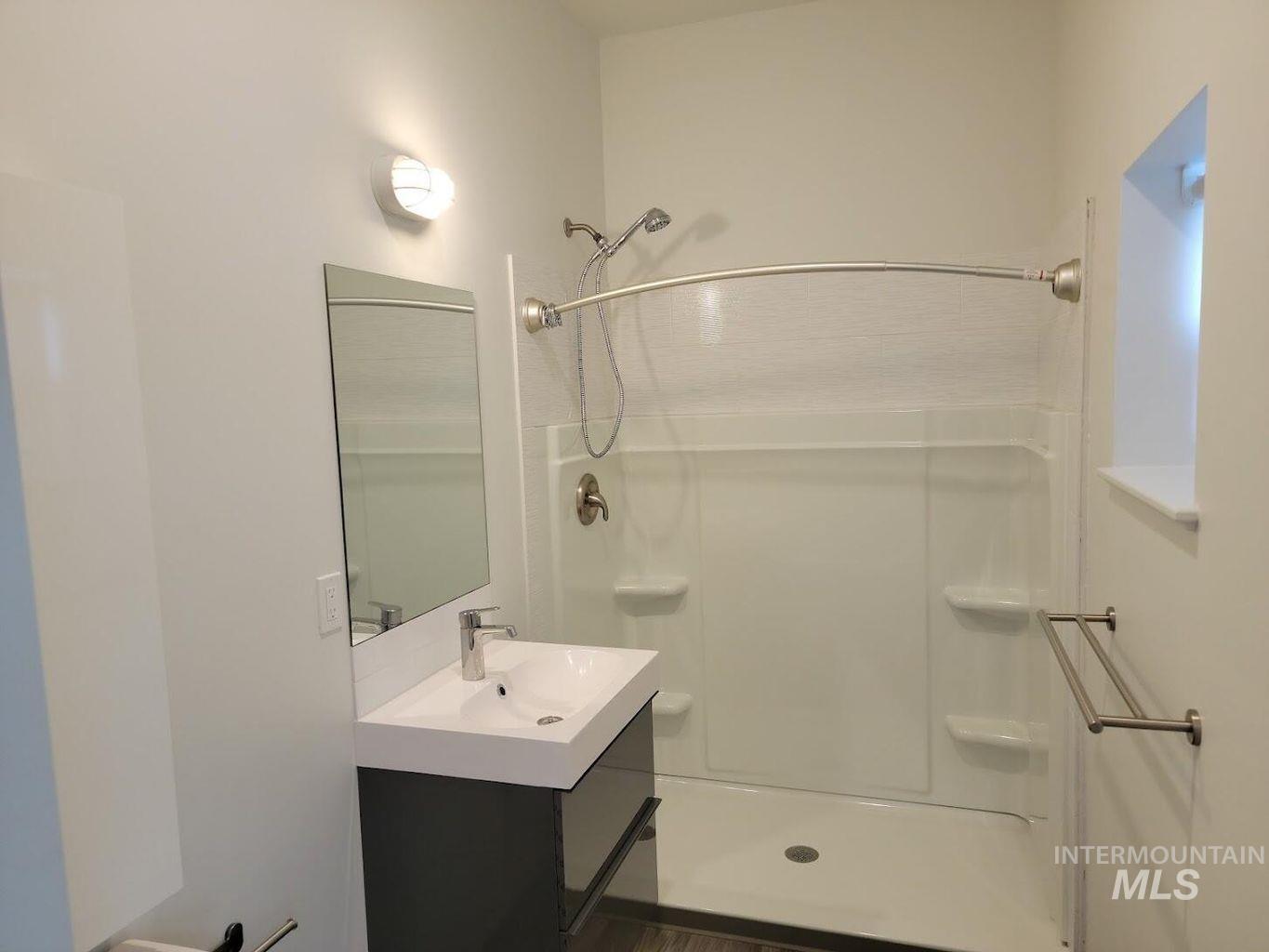 121 Honeysuckle Street Bellevue, ID 83313 - Photo 7 of 13 Full bath featuring vanity and a stall shower