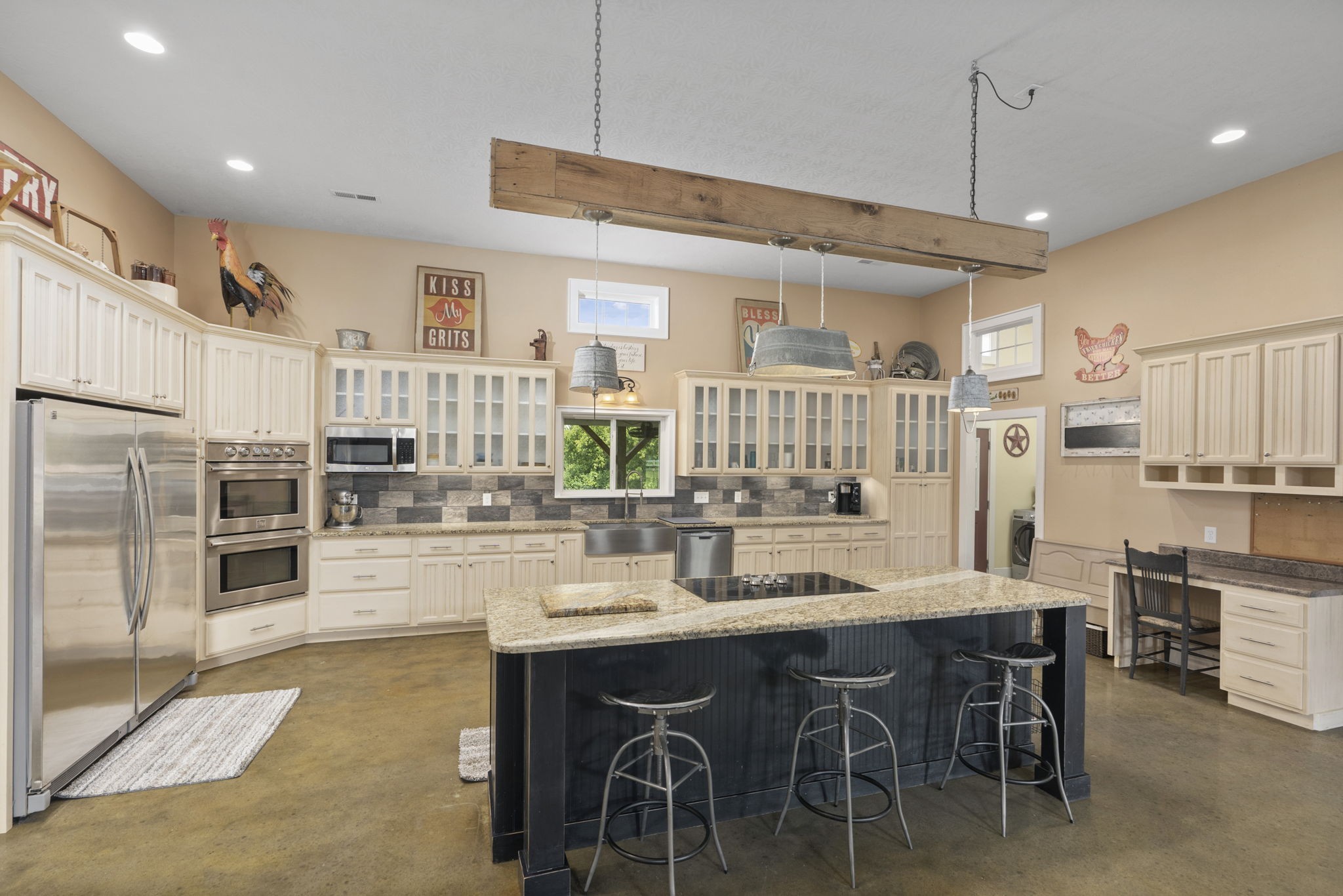 407 Moore Link Road Portland, TN 37148 - Photo 13 of 53 a large kitchen with a table and chairs