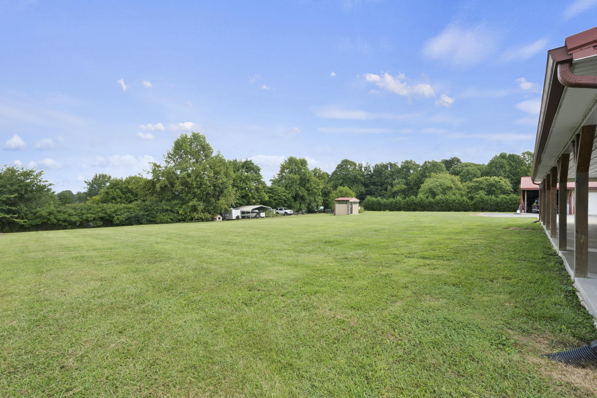 407 Moore Link Road Portland, TN 37148 - Photo 46 of 53 a view of a field of grass and trees