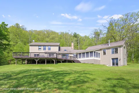 a backyard of a house with lots of green space