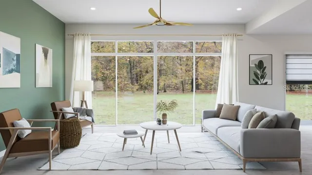 a kitchen with stainless steel appliances granite countertop a sink and a refrigerator