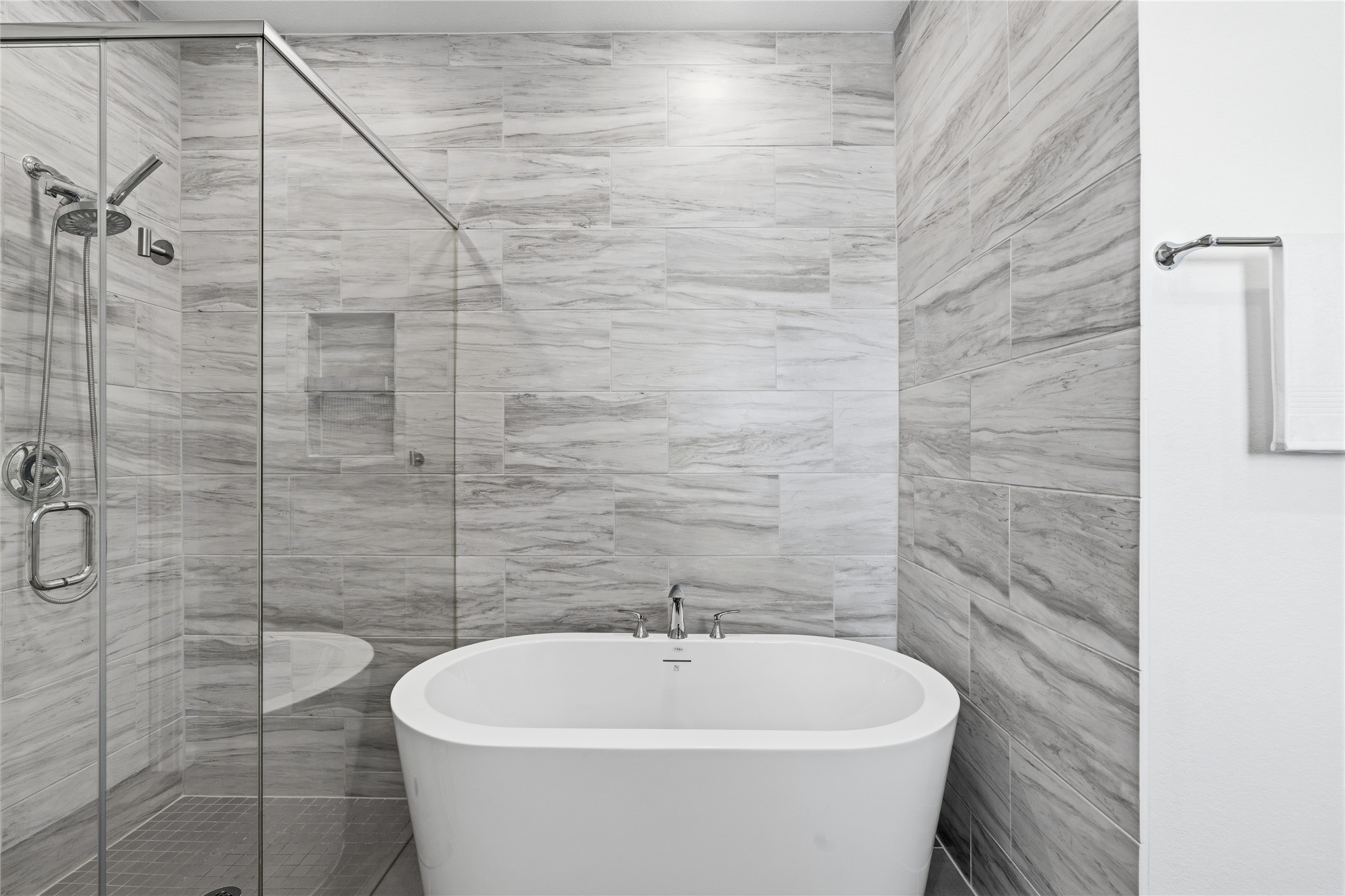 416 Bartlett Street Webster, TX 77598 - Photo 27 of 49 Spa-style bath with freestanding soaking tub and frameless glass shower
