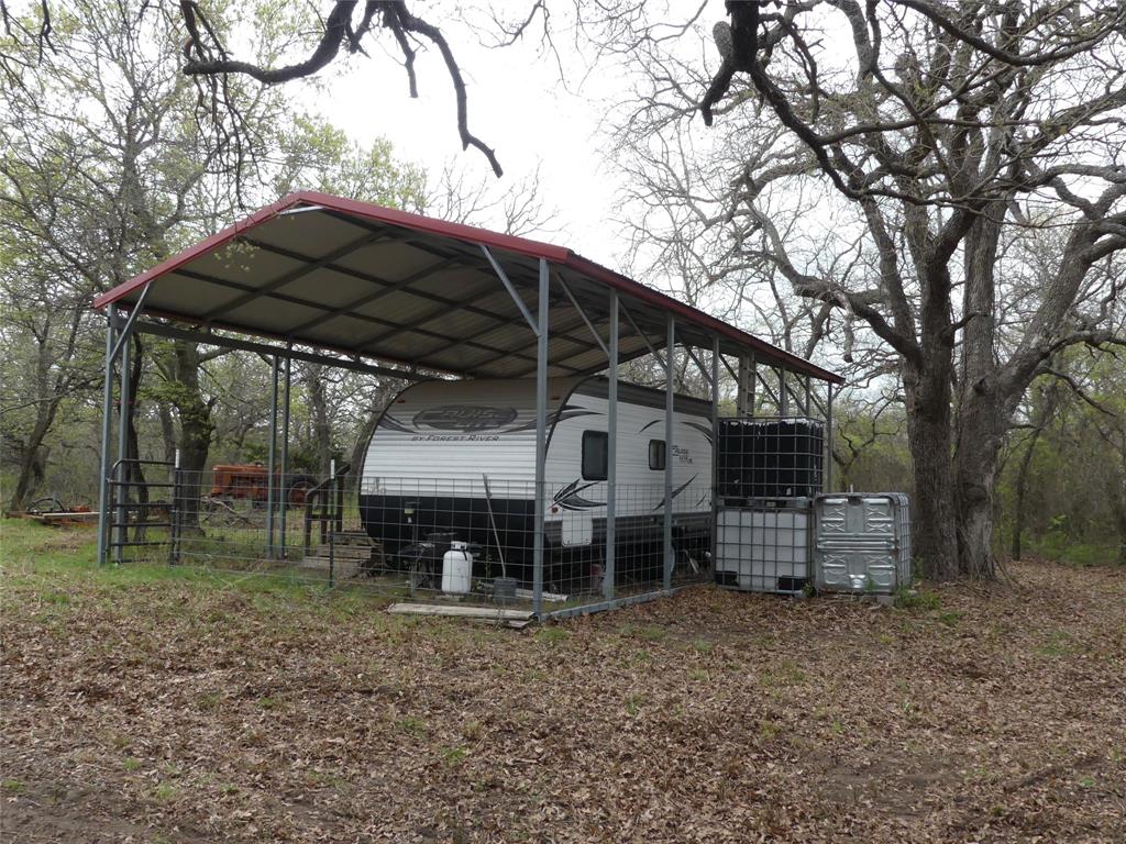 Tbd Dye Mound Road Forestburg, TX 76239 - Photo 21 of 26 View of parking / parking lot featuring a carport