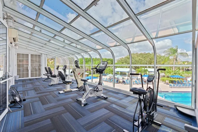 a view of a room with lots of wooden furniture