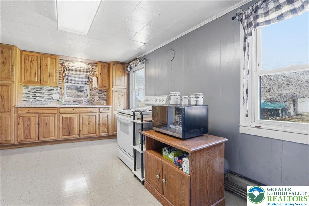 4532 Long Run Road Lehighton, PA 18235 - Photo 25 of 84 a kitchen with stainless steel appliances granite countertop a stove and a refrigerator