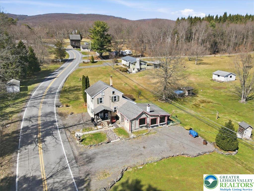 4532 Long Run Road Lehighton, PA 18235 - Photo 5 of 84 a view of a swimming pool with a yard and mountain view