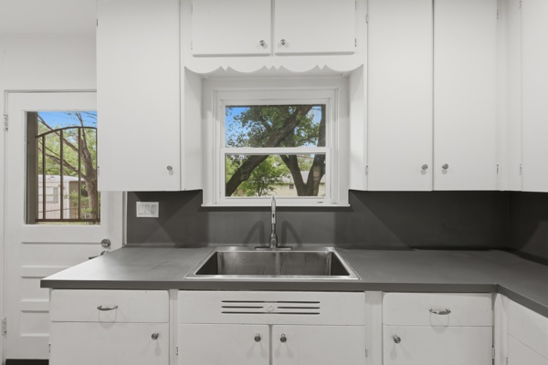 1608 Burt Street Bryan, TX 77802 - Photo 9 of 16 a kitchen with a sink and cabinets