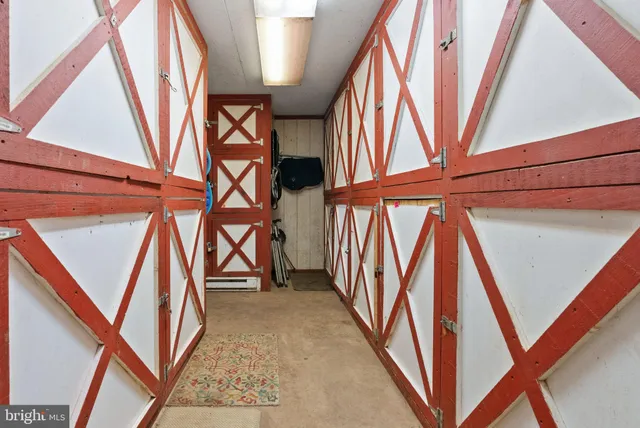 an aerial view of a swimming pool with lawn chairs