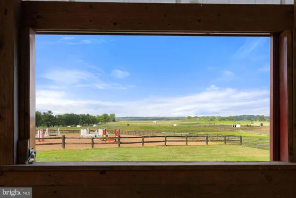 a view of a house with a yard porch and sitting area