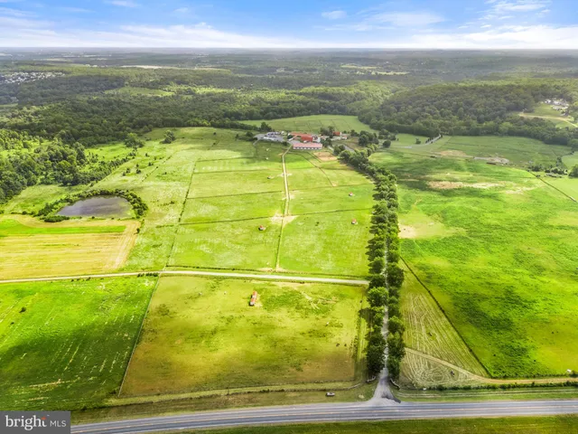 a view of a lake with a house in the background