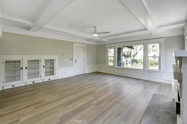 a view of entryway and hall with wooden flooring