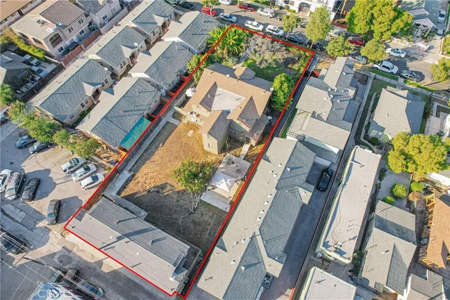an aerial view of a house with a garden