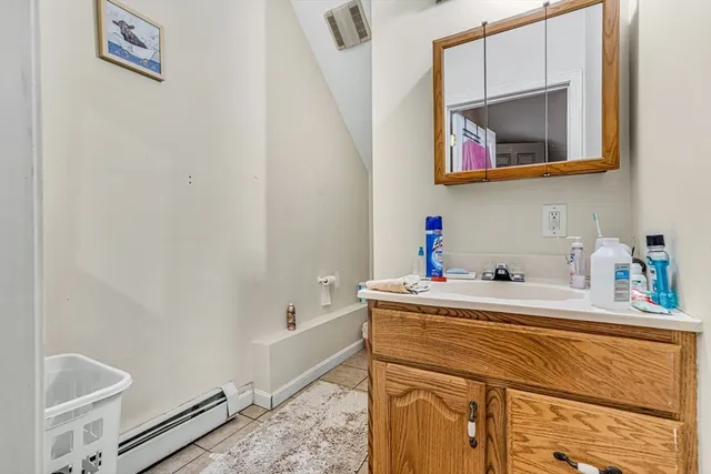 a utility room with a sink dryer and washer