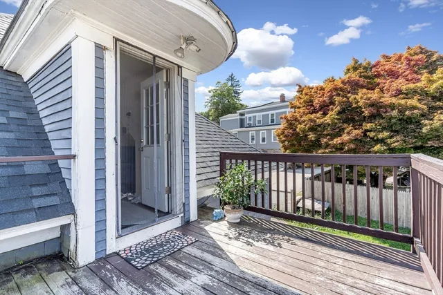 a view of a balcony with wooden floor