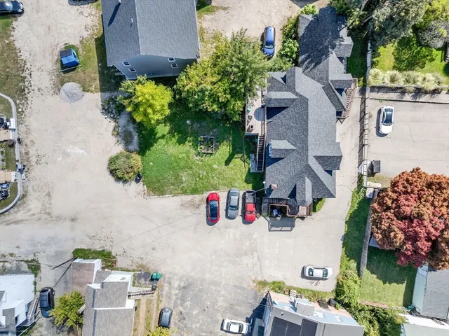 an aerial view of residential houses with outdoor space