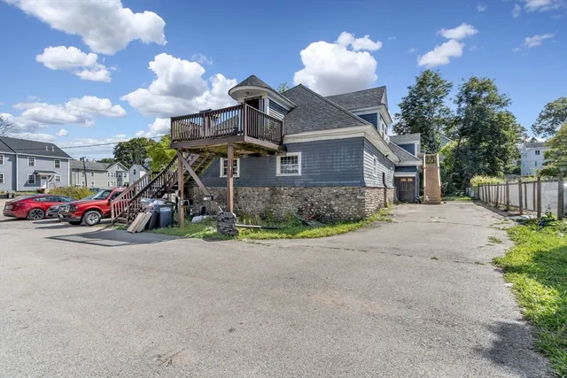 a view of a house with a yard and garage
