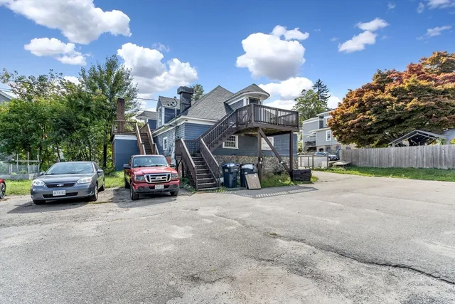 a view of a cars parked in front of a house