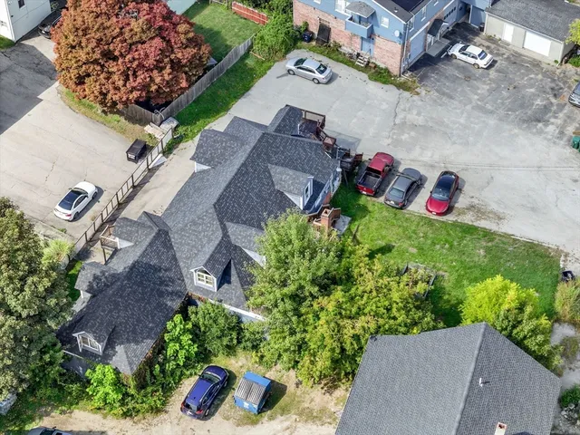 an aerial view of a house with outdoor space