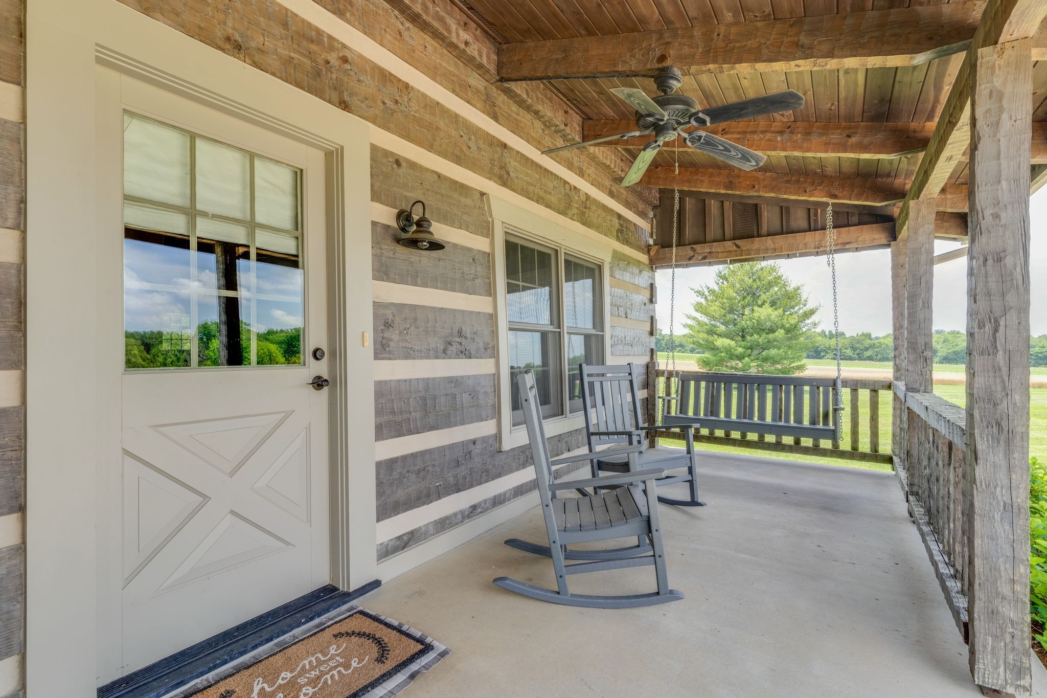 5110 Fred Perry Road Springfield, TN 37172 - Photo 6 of 36 a porch with a table and chairs