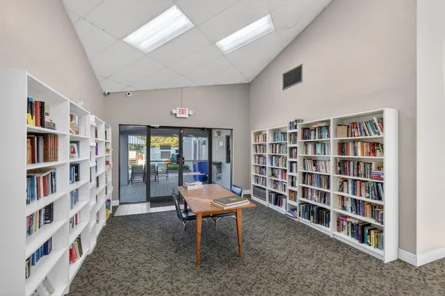 an aerial view of house with yard swimming pool and outdoor seating
